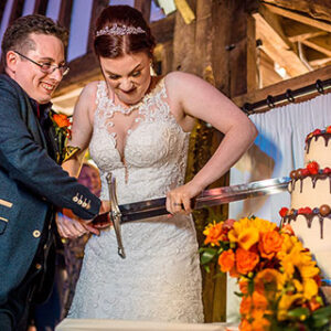 Bride and Groom Cutting The Cake